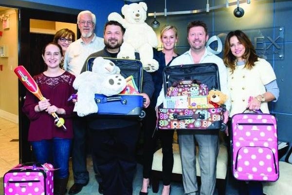 Apex CPAs & Consultants Raise Over $57,000 in Eighth Annual Luggage of Love Campaign Benefitting CASA Kane County